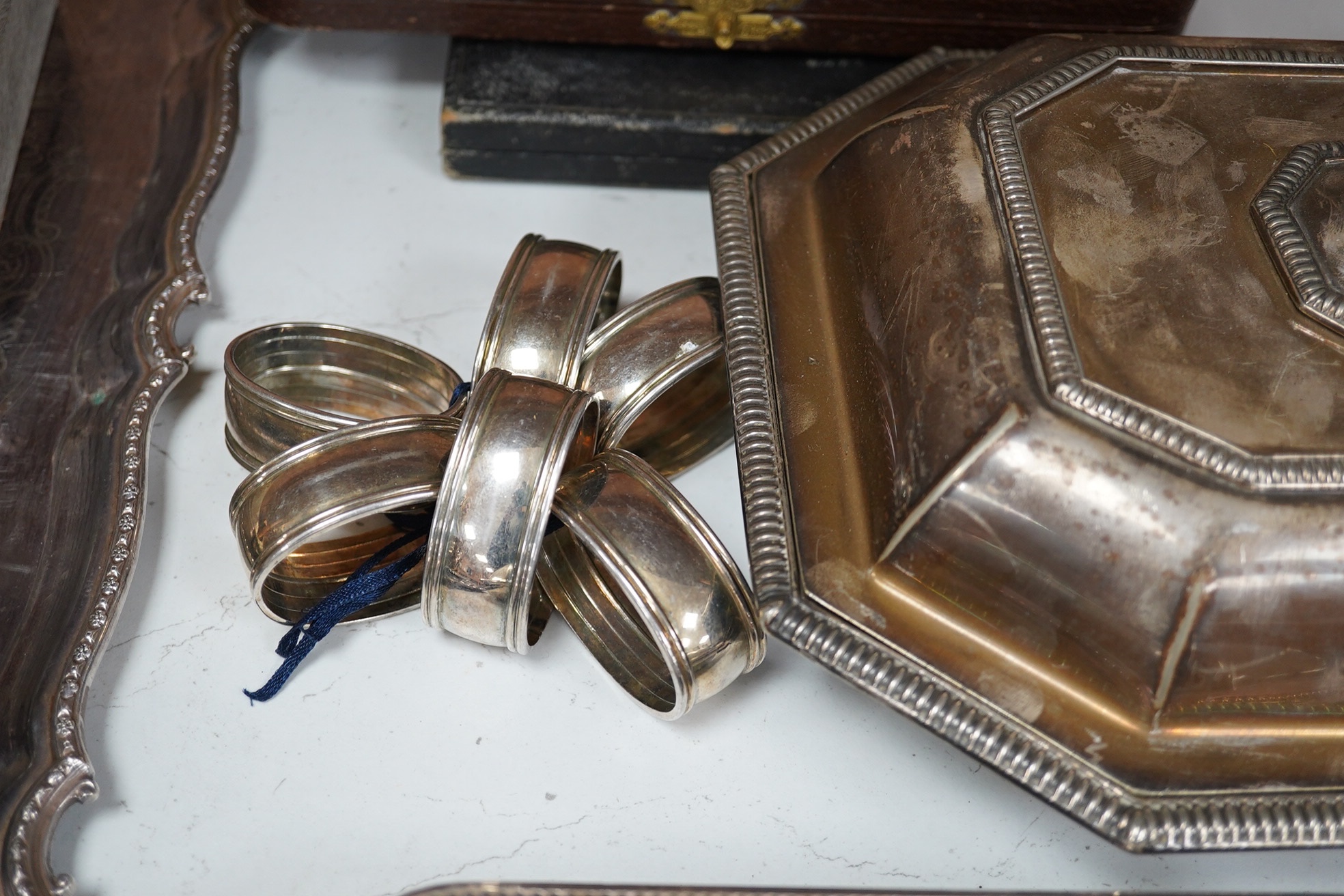 A quantity of plated wares including two entree dishes and covers, napkin rings, cream jug, trays, etc. Condition - fair